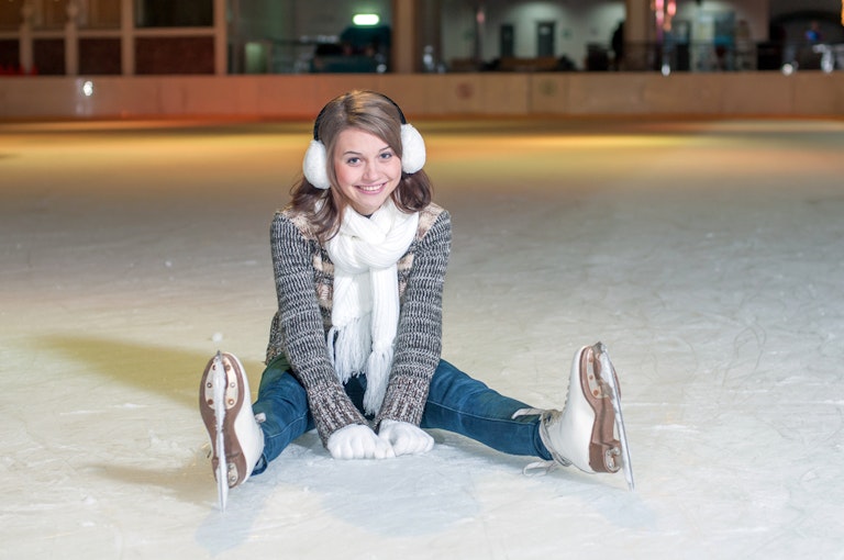 Young beautiful girl smiling on the ice
